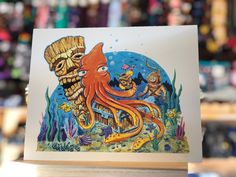 an octopus and skeleton are depicted in this card