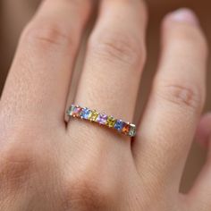 A stacking rainbow sapphire ring in 14K solid white gold in prong setting. A multicolor half eternity wedding band for women. The best Valentine's gift for her! 100% handcrafted with love! PRODUCT DETAILS * Metal: 14K solid gold, 14K white gold or 14K rose gold * Gemstone: 9 Sapphires, princess cut * Sapphires' Weight: 1.11ct total RING SIZING For General Reference: * we use standard US Ring Sizing * an average women's ring finger is size 6 * if your ring size is not listed please contact us HOW Rainbow Gemstone Stackable Rings For Anniversary, Rainbow Multi-stone Stackable Promise Rings, Rainbow Multi-stone Stackable Rings For Promise, Rainbow Sapphire Anniversary Ring Fine Jewelry, Rainbow Sapphire Ring For Anniversary, Wedding Band For Women, Best Anniversary Gifts, Sapphire Wedding Band, Rainbow Sapphires