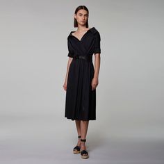 The 'Lydia' dress is designed from airy cotton poplin in a relaxed midi silhouette with an elasticized waist. The frock has an open collared neckline and on-seam pockets that exude undone ease. Cotton Poplin, Black Dress, Black