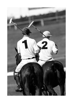 two polo players on horses with their backs turned to the opposite direction, facing each other