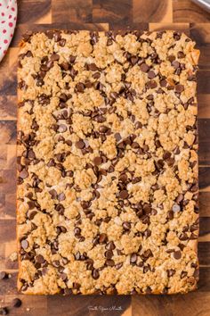 an oatmeal cookie bar on a wooden cutting board