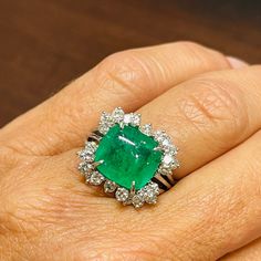 Platinum 5.34ct. Sugarloaf cushion cut Columbian emerald in a beautiful green.  This emerald is certified by Stone Grade Laboratory The  platinum ring is prong set with round brilliant cut diamonds weighing approximately 2.60cts. with clarity and color approximately VS1-2, F-G.  Ring size 7.5.  Can be sized to any finger. Columbian Emeralds, Golden Rings, Lab Report, Emerald And Diamond Ring, Emerald Gem, Golden Ring, Platinum Ring, Green Emerald, Silver Cuff