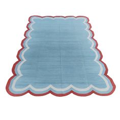 a blue rug with red trims on it