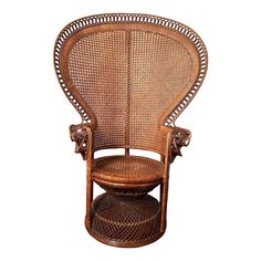 an antique rattan chair with wicker seat and footrests on white background