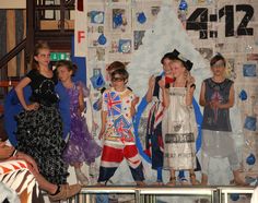 several children are standing on stage with their costumes made to look like the british flag