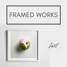 an image of framed works with apple and doughnut in the middle on white background