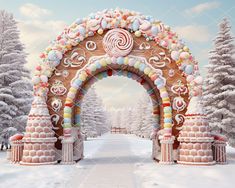 an archway decorated with candy and candies in the middle of a snow covered forest