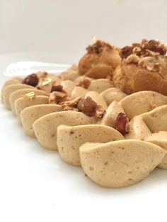 a white plate topped with lots of cookies