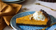 a slice of pumpkin cheesecake on a blue plate