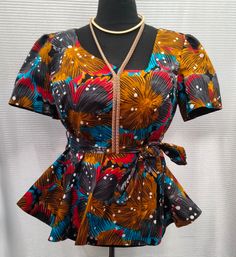 Beautiful handmade Ankara peplum top with detachable belt,made with 100% ankara fabric Size uk 18 Blouse length 28 Bust 44 Waist 38 Fully lined with plain black cotton fabric Stoned zipper at the back Short sleeves Pair with your leggings,skirt,trouser Ankara Tops Blouses, Ankara Kimono, Noir Uni, Ankara Tops, African Print Clothing, African Prints, Ankara Fabric, Plain Black, Skirt Leggings