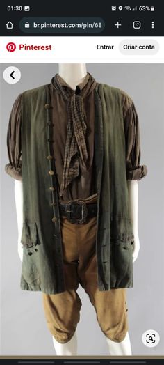 a mannequin dressed in brown and green clothing with buttons on the chest,