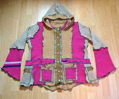 "\"rASPBERRY RIPPLe\" ice cream sweater jacket, upcycled from knits of accented pink, biscuit and wafer pattern, with candy pink and bubble gum blue buttons. Complete with four pockets, quadruple the choice to store your keys. UK size 16- 18 Chest 46 inches Shipping included in price. I have other prodigious prismatic knitwear, funky dresses and tops in my shop, so please have a browse. REFUNDS Important note about refunds. I no longer offer refunds outside of the UK due to customs charges incurred. Please check measurements and feel free to message if further measurements are needed. Thankyou." Cozy Fall Festival Cardigan, Cozy Long Sleeve Festival Outerwear, Bohemian Long Sleeve Patchwork Sweater, Casual Winter Festival Sweater, Bohemian Knit Outerwear For Winter, Bohemian Winter Knit Outerwear, Handmade Long Sleeve Festival Sweater, Bohemian Knitted Winter Sweater, Bohemian Pink Knit Cardigan