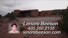 a business card with an image of a woman in front of a house on a hill