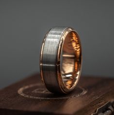 Rose Gold and Silver 8mm wedding band for men with unique brushed and polished finish, perfect for modern grooms. Rose Gold And Silver Wedding, Gold And Silver Wedding Band, Gold And Silver Wedding, Mens Engagement Ring, Modern Groom, Mens Wedding Ring, Silver Wedding Band, Rose Gold And Silver, Engraved Ring