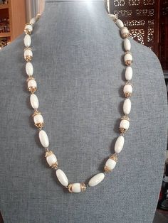 Necklace is 28 inches in length White Oval Single Strand Necklace, White Oval Beaded Jewelry, Formal White Necklaces With Gold Beads, Vintage White Oval Bead Necklaces, Vintage White Oval Beads Necklaces, Vintage White Necklaces With Oval Beads, Vintage White Oval Beaded Necklaces, Flagstaff Az, Silver Cleaner