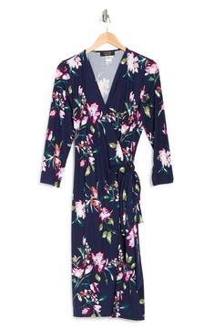 Sprigs of classic florals adorn a wrap front, jersey knit dress that is perfect for any occasion. Surplice V-neck Long sleeves Wrap front closure Floral print 95% polyester, 5% spandex Machine wash, line dry Made in USA Model stats: 5'10" height, 41" bust, 36" waist, 48" hip. Model is wearing size 1X Floral Print V-neck Loungewear Dress, V-neck Floral Print Wrap Dress For Daywear, V-neck Floral Print Dress For Loungewear, Jersey Wrap Dress, Jersey Knit Dress, Knit Dress, Knit Jersey, Nordstrom Rack, Wrap Dress