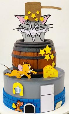 a cake made to look like a cat and mouse