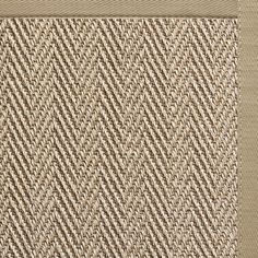 a close up view of the beige and brown herringbone pattern on a fabric background