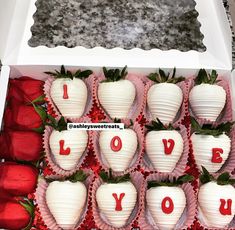 strawberries with love written on them in a box