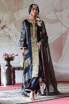 Black kurta with a sequin embroidered placket. Paired with an embroidered palazzo and tissue dupatta with an embroidered border. - Aza Fashions Silk Unstitched Suit For Reception And Navratri, Elegant Tussar Silk Palazzo Set With Sheer Dupatta, Elegant Tussar Silk Dupatta With Mirror Work, Tussar Silk Sets For Navratri Party, Tussar Silk Party Sets For Navratri, Navratri Party Sets In Tussar Silk, Wedding Tussar Silk Dupatta With Mirror Work, Transitional Party Tussar Silk Dupatta, Tissue Dupatta