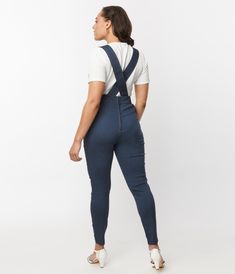 These chic overalls are crafted in dark denim bengaline and are outfitted with button adjustable suspenders straps while the front placket features a chest pocket and button flap. Complete with skinny legs, back zipper, and side pockets.Available in sizes XS-5X while supplies last Dark Denim Overalls, Denim Overalls, Dark Denim, Suspenders, Chest Pocket, Unique Vintage, Overalls, Zipper, Blue