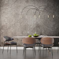 a dining table with four chairs around it and an artistic wallpaper design behind it