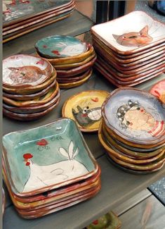 there are many plates that have animals on them