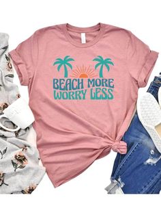 Introducing the Beach More Worry Less Women's Graphic T-Shirt, the perfect addition to your summer wardrobe. Available in 8 colors and sizes XS-XXXL, this t-shirt is perfect for every woman. Its comfortable and stylish design make it perfect for vacations, beach days, and more. Made from high-quality materials, this t-shirt is soft, comfortable, and lightweight, ensuring your comfort during hot summer days. Its fun and playful graphic design encourages you to embrace the carefree spirit of summe Beachy Crew Neck T-shirt With Funny Print, Pink Relaxed Fit T-shirt For Vacation, Slogan T-shirt For Beach Vacation, Vacation Cotton T-shirt With Text Print, Beachy Crew Neck Tops With Text Print, Vacation Tops With Text Print And Crew Neck, Vacation Crew Neck Top With Text Print, Trendy Pre-shrunk T-shirt For Beach Season, Trendy T-shirt With Text Print For Vacation