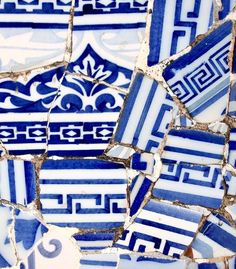 blue and white tiles with designs on them