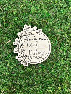 save the date magnet on grass