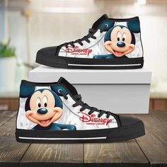 Mickey Mouse Disney High Top Shoes Urban High Tops High-top canvas shoes exude a unique blend of casual comfort and trendy fashion. These iconic shoes feature a high-rise design that wraps the ankle, providing exceptional support and style. Crafted from breathable and lightweight canvas material, they offer comfort and flexibility for everyday wear. Their versatile nature effortlessly transitions from laid-back outings to trendy urban styles, allowing for easy pairing with various outfits. The l Black High Top Shoes, Donald And Daisy Duck, Disney High, Running Gifts, Comfortable Walking Shoes, Disney Mouse, Monochrome Design, Daisy Duck, Black High Tops