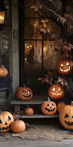 halloween pumpkins on the porch with lit candles