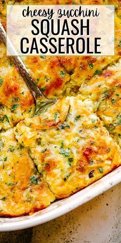 cheesy zucchini squash casserole in a white dish with a serving spoon