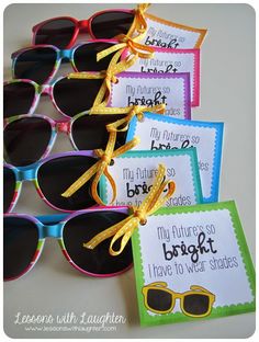 several pairs of sunglasses with tags attached to them