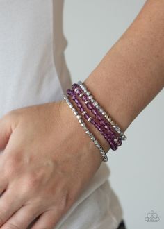 A glittery collection of faceted silver beads and purple and metallic flecked crystal-like beads are threaded along stretchy bands around the wrist, creating sparkly layers. Sold as one set of three bracelets. P9RE-PRXX-108XX Paparazzi Accessories Jewelry, Smoky Crystal, Bracelet Set Silver, Rose Gold Beads, Purple Bracelet, Silver Frames, Crystal Accessories, Paparazzi Accessories, Blue Gems