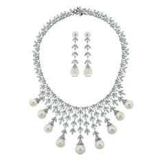 A timeless classic, the Diamond & Pearl Vines Necklace & Earrings Suite is a fine balance of elegance and flamboyance.  Gemstones Type: Pearl Gemstone Origin: South Sea  Gemstones Shape: Drop Shape Gemstones Weight: 136.80 ct (Necklace) & 33.12 ct (Earrings) Gemstones Color: White  Diamonds Shape: Round Tot Diamond Pearl Necklace Set, South Sea Pearl Necklace, Pearl And Diamond Necklace, Gold For Sale, Pearl Necklace Earrings, Diamond Free, Pearls Necklace, Classy Jewelry, Antique Necklace