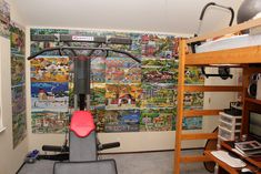 there is a bike in the room with many pictures on the wall and shelves below it