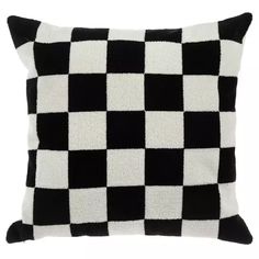 a black and white checkered pillow on a white background