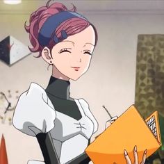 a woman with pink hair is holding an orange folder and looking at the camera while standing in a room