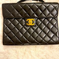 Chanel's Super Soft Lambskin Leather With Stunning Gold Hardware. This Classy Piece Has An Inside Zipper As Well As An Open Pocket, With A Pocket On The Back. Approx Dimensions 14.5"Length X 11.5." Height X 2" Width Rarely Used And Cared For And Is In Excellent Condition! Quilting Is Still Puffy, With No Dents And Only Very Minor Wear (Scratches). Hardware Has No Scratches Or Flaws. Includes Box And Dust Bag, Which It Has Always Been Stored In. Smoke Free Home! Please No Low Ball Offers. Leather Briefcase, Chanel Bags, Lambskin Leather, Laptop Bag, Chanel Bag, Gold Hardware, Dust Bag, Quilting, Chanel