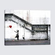 a girl with a heart balloon on the side of a building