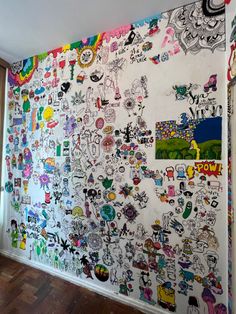 a wall covered in lots of cartoon stickers