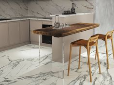 a kitchen with marble flooring and counter tops, two stools at the bar