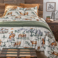 a bed with horses on it in a bedroom next to a wooden headboard and night stand