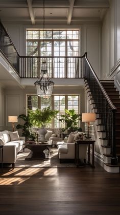 a living room filled with furniture and a stair case