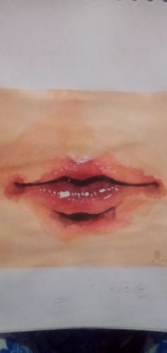 a painting of a woman's lips on a piece of paper