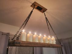 a chandelier with candles hanging from it