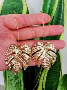 Large Gold Monstera Leaf Statement Earrings Measurement: 8.5x3.6 cm 💜All jewellery will be sent with a gift bag. If you would like, you can add a personal message that I will include in the package💜 Free UK delivery My own honest experience is: They are not 100% tarnish-free. However, if you look after them, it will last a good while. Leaf-shaped Metal Earrings For Party, Leaf-shaped Metal Jewelry For Party, Gold Leaf-shaped Earrings For Party, Trendy Leaf-shaped Jewelry Gift, Leaf-shaped Metal Jewelry Gift, Metal Leaf-shaped Jewelry For Gifts, Metal Leaf-shaped Jewelry Gift, Gold Leaf-shaped Hoop Earrings For Gift, Leaf-shaped Metal Jewelry For Gifts