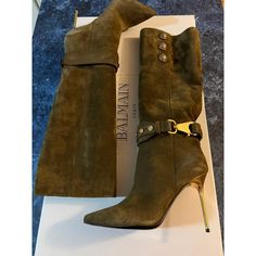 Balmain Robin Suede Knee-High Boots Khaki/Olive Green Color Women’s Eu 37/Us 7 $1,695. New With Box. Luxurious Suede Boots Detailed With Goldtone Logo Embossed Buttons And Clasp Strap That Wraps Around The Ankle. Leather Upper Point Toe Pull-On Style Side Buttons Leather/Rubber Sole Made In Italy Size Self-Covered Stiletto Heel, 3.75" Chic Green Closed Toe Boots, Olive Round Toe Boots For Fall, Green Suede Boots With Pointed Toe, Olive Leather Boots For Fall, Fall Olive Leather Boots, Designer Green Boots With Round Toe, Jean Thigh High Boots, Balmain Boots, Leather Thigh Boots