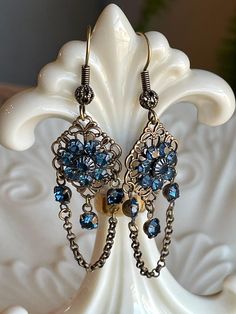 These cute boho inspired chandelier earrings measure about 2 inches long.  Will go with your favorite pair of jeans or that new spring dress!  Will be shipped USPS first class mail and free shipping. Blue Bohemian Crystal Drop Earrings, Bohemian Blue Crystal Drop Earrings, Vintage Blue Dangle Chandelier Earrings, Blue Vintage Dangle Chandelier Earrings, Blue Bohemian Crystal Earrings, Bohemian Blue Crystal Earrings, Bohemian Blue Metal Chandelier Earrings, Blue Metal Bohemian Chandelier Earrings, Etsy Earrings Dangle